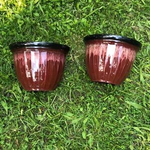 Two maroon planters.